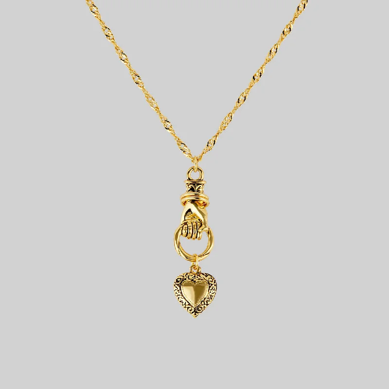 Ragged edge necklace-ALL OF ME. Hand Grasping Heart Necklace - Gold