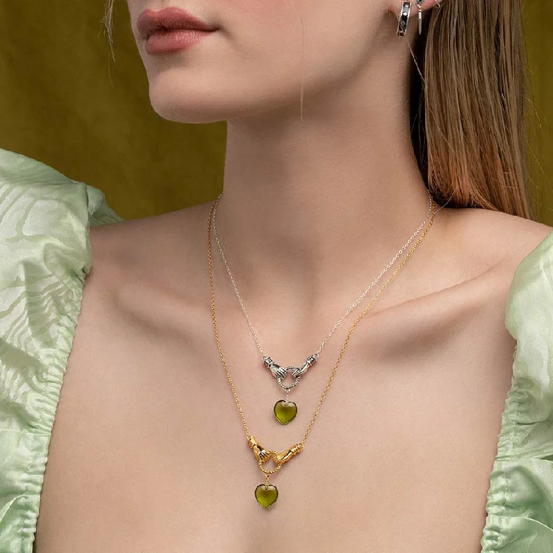 Shimmering jade necklace-UNITE. Hand Grasping Green Glass Heart Necklace - Gold